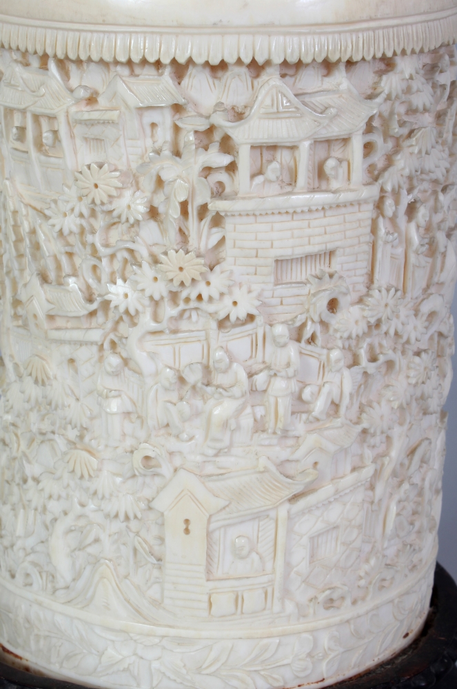 A GOOD LARGE 19TH CENTURY CHINESE CANTON IVORY BRUSHPOT, together with a fixed wood stand, the sides - Image 5 of 7