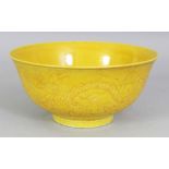 A CHINESE MING STYLE YELLOW GLAZED PORCELAIN DRAGON BOWL, with underglaze incised decoration, the