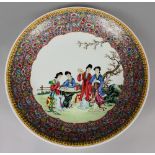 A LARGE 20TH CENTURY CHINESE FAMILLE ROSE PORCELAIN DISH, of saucer shape, the interior decorated