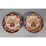 A PAIR OF IMARI STYLE PORCELAIN PLATES, of larger than average size, each base with a maker's