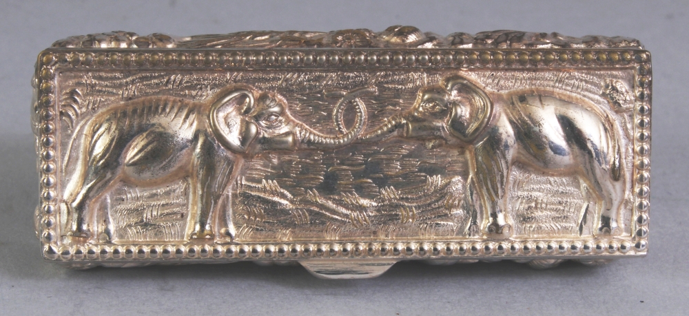 A SOUTH-EAST ASIAN SILVER-METAL RECTANGULAR PILL BOX, weighing approx. 29gm, the cover embossed with - Image 6 of 8