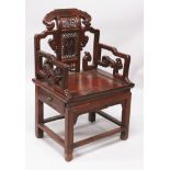 A 20TH CENTURY CHINESE HARDWOOD ARMCHAIR, with pierced lingzhi and scroll arm rests, the back with