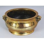 AN 18TH/19TH CENTURY CHINESE POLISHED BRONZE BOMBE CENSER, weighing 770gm, the sides cast with