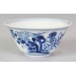 A CHINESE KANGXI PERIOD BLUE & WHITE PORCELAIN TEABOWL, circa 1700, painted with rockwork, foliage