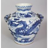 A CHINESE YUAN STYLE BLUE & WHITE PORCELAIN DRAGON VASE, with moulded animal-head handles, the