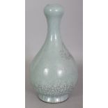 A CHINESE CELADON CRACKLEGLAZE PORCELAIN BOTTLE VASE, with a garlic neck, 10.75in high.