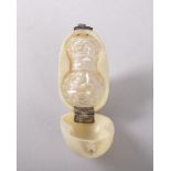 A EUROPEAN IVORY CASED CLEAR CUT GLASS SCENT BOTTLE. 4.5cms. Provenance: PARIS 1977.