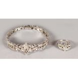 A SUPERB 18CT WHITE GOLD AND DIAMOND BRACELET AND RING, set with 4cts of diamonds.