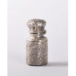 A VICTORIAN MINIATURE SILVER PERFUME BOTTLE AND STOPPER. London 1891. 2.5cms. Provenance: CHELSEA