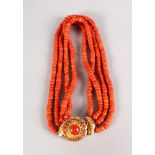 A GOOD FOUR ROW CORAL NECKLACE with gold and coral clasp, 117gms.