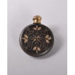 A 19TH CENTURY FLAT CIRCULAR PERFUME BOTTLE, tortoiseshell with gold inlay. 3.5cms. See Lambert,