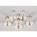 A SET OF SIX .925 SILVER OWL MENU HOLDERS.