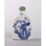 A CHINESE PORCELAIN BLUE AND WHITE SNUFF BOTTLE, decorated with a man in a garden holding a flag,