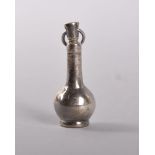 A MINIATURE EUROPEAN SILVER VASE SHAPED PERFUME BOTTLE with long neck. 3.5cms. Provenance: SHEPTON