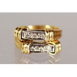 AN 18CT YELLOW GOLD DOUBLE ROW DIAMOND RING.