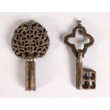 A TINY PIERCED POLISH STEEL KEY, 2ins, and A SMALL FOLDING KEY, 2ins (2).