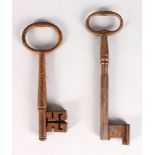 TWO 17TH CENTURY IRON KEYS. 7ins and 6.5ins long.