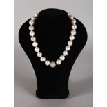 A MILLEPERLE SET OF TWENTY-SEVEN 1.5CM PEARLS with diamond clasp, in original box.