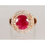 A VERY GOOD DIAMOND AND RUBY CLUSTER RING.