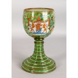 A LARGE CONTINENTAL PAINTED GOBLET with crest. 11ins high.