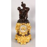 J. FEUCHERE A GOOD BRONZE AND ORMOLU MANTLE CLOCK, surrounded with a group of four playful