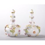 A MINIATURE PAIR OF MEISSEN PORCELAIN SCENT BOTTLES AND STOPPERS, CIRCA. 1880, the white ground