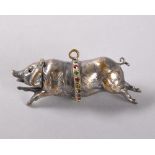 A SMALL SILVER PLATED PERFUME BOTTLE in the shape of a pig, with a band of coloured stones. 5cms