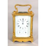 A GOOD GERMAN ORMOLU REPEATER CARRIAGE CLOCK, with white porcelain dial, black enamel numerals and