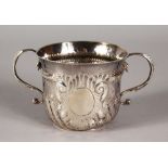 A GEORGE II TWO HANDLED PORRINGER, wrythen flued bead work to the handles. 3.5ins diameter. London