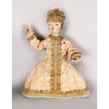 A RARE 18TH CENTURY CARVED WOOD DOLL, wearing an Indian dress. 17ins long.