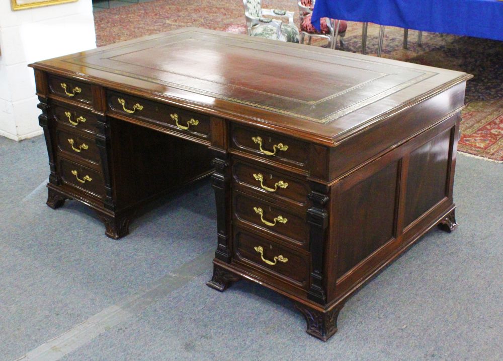 A SUPERB HARRODS "GILLOW MODEL" MAHOGANY PARTNERS DESK with inset leather top tooled in gilt, one
