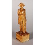 A SALTGLAZE FIGURE OF LORD NELSON, standing on a plinth, dated 1805-1905. 6ins high.