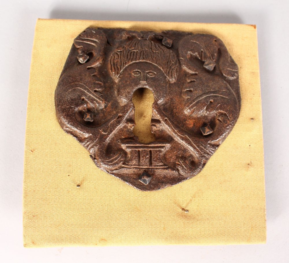 AN EARLY 17TH CENTURY CAST IRON LOCK FACE. 6ins.