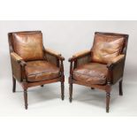 A GOOD PAIR OF LATE REGENCY STYLE MAHOGANY BERGERE ARMCHAIRS, with double cane backs and sides
