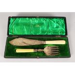 A PAIR OF CASED FISH KNIVES AND FORKS by WALKER & HALL.