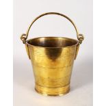 A GOOD 18TH CENTURY BRASS BUCKET with swing handle. 9ins high.