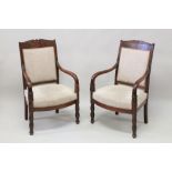 A GOOD PAIR OF EMPIRE MAHOGANY OPEN ARMCHAIRS, with padded backs and seats, curving arms, on