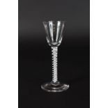 A GEORGIAN WINE GLASS with opaque twist stem and funnel bowl. 6ins high.