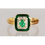 AN 18CT GOLD, EMERALD AND DIAMOND RING.