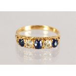 AN 18CT GOLD, SAPPHIRE AND DIAMOND HALF HOOP RING.