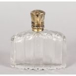 A CUT CRYSTAL FRENCH SCENT BOTTLE with silver top. 2.5ins long.