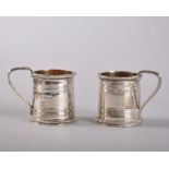 A PAIR OF ENGRAVED MINIATURE VICTORIAN SILVER TANKARDS. London 1869.