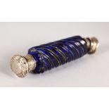 A VICTORIAN DOUBLE ENDED BLUE GLASS SCENT BOTTLE with silver top. 6ins long.