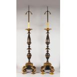 A SUPERB PAIR OF LARGE BRONZE AND GILT BRONZE STANDING PRICKET STICKS, converted to candle lamps,