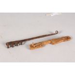 AN EARLY WOODEN KEY, 6ins long, and AN UNUSUAL IRON KEY, 7.5ins (2).