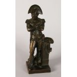 A GOOD 19TH CENTURY BRONZE OF NAPOLEON, arms crossed, standing beside a pillar, on a square base.