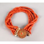 A GOOD FIVE ROW CORAL NECKLACE with gold and coral clasp, 164gms.