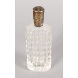 A CUT CRYSTAL FRENCH SCENT BOTTLE with silver top. 3.25ins long.