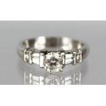A PLATINUM SET DIAMOND RING, the central stone of 1.2cts with diamond shoulders, F/G colour, SI1