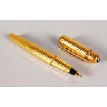 A VERY GOOD CARTIER GILT BIRO PEN, 14cms long, in a Cartier red envelope.